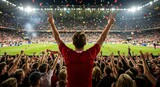 Rear view of excited man at a soccer stadium giving the victory sign with confetti falling. Sports fan cheering for his favorite team during a match at an arena.