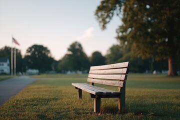 Poster - empty park bench under american flag on beautifully clear memorial day morning
