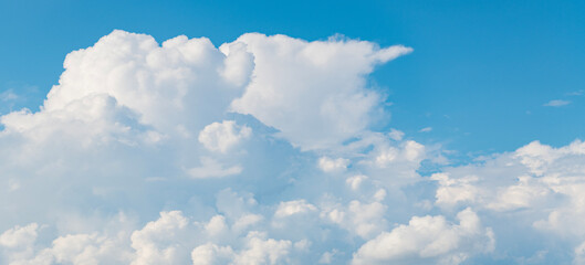 Wall Mural - Blue sky with clouds in the sky. Beautiful blue sky background with clouds.Natural and cloudy fresh blue sky background. White fluffy clouds in the blue sky.