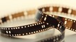 © Umid - Curved film strip icon.Roll of retro film strip on isolated transparent background. Photographic film in retro style. Curved film strip PNG.