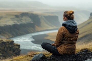 Poster - Contemplation on a rocky ledge during sunset in an expansive canyon landscape