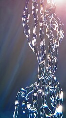 Poster - Transparent liquid flows gracefully, forming intricate and evolving shapes, creating a mesmerizing visual display with subtle light reflections