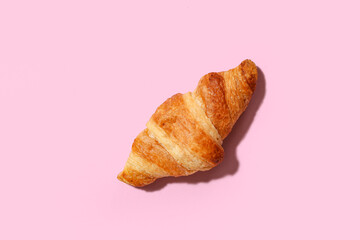 Wall Mural - tasty croissant on pink background