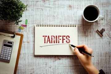 Poster - There is notebook with the word Tariffs. It is as an eye-catching image.