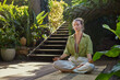 © Rido - Young woman practicing yoga in the middle of nature