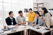 © Dino - Brainstorming of young modern group. Team meeting to achieve goal. Business people discussing finance business and analysis. Teamwork concept in modern office. Calculating personal tax for client.
