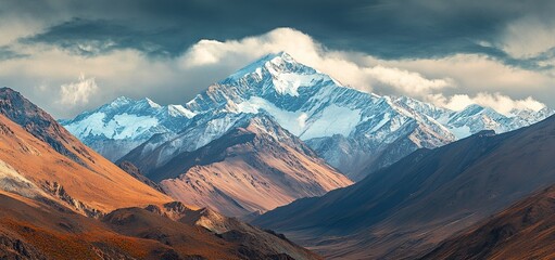 Wall Mural - beautiful view of the majestic snow-capped peak with clouds on top in the himalayas, conceptual phot