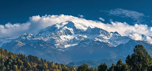 Wall Mural - beautiful view of the majestic snow-capped peak with clouds on top in the himalayas, conceptual phot