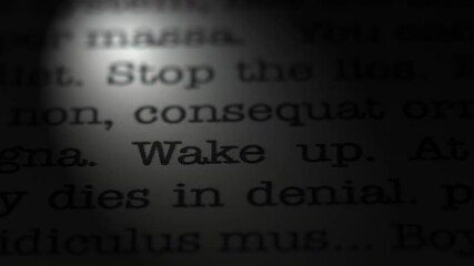Leinwandbilder - Wake up. Moving text printed on a page. Slow motion. A piece of paper with a phrase written in retro typewriter font. Spotlight effect. Dark dramatic video.