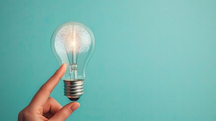 Poster - Hands of robot and human touching for digital interaction innovation concept. Bright light bulb held by hand against a turquoise background.