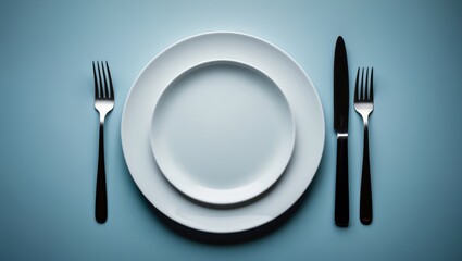 Poster - Clean plate, fork, and knife on background from a top view with space for text