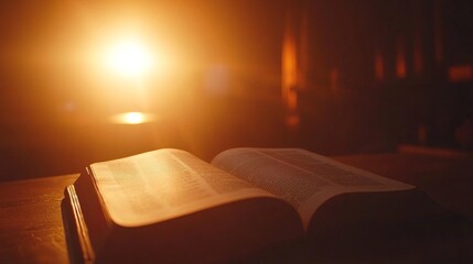 Poster - An open book with slightly curled, aged pages rests on a wooden desk, illuminated by warm light, creating an inviting atmosphere with ample copy space beside it