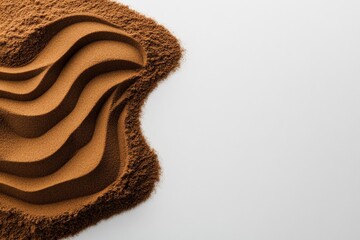 Poster - Sandy landscape on a white background, top view. Sand pile with copy space for your design. Beige-colored sand texture. Earthy color concept, isolated on a pastel background