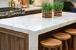 © ChaoticMind - Modern kitchen with marble countertop and wooden stools in inviting interior design