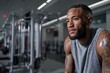 © Milos - A male athlete pauses mid-training in a gym, capturing an introspective moment that showcases resilience, strength, and dedication within a modern fitness environment.