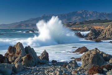 Aufkleber - Waves crash against rocky shore at a scenic coastal location during a clear morning