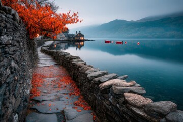 Poster - autumn pathway along tranquil lake with vibrant foliage and peaceful reflections at dusk