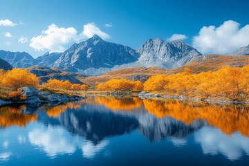 Poster - Vibrant autumn landscape with mountains reflecting on a calm lake under a clear blue sky