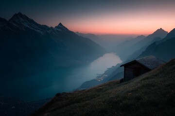 Aufkleber - Sunset over the tranquil lake and mountains in Switzerland, viewed from a hillside cabin