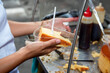 © Harold - A woman displays homemade flan or Venezuelan cheese. Homemade food.