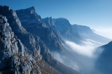 Aufkleber - Majestic mountain landscape with mist rolling through valleys at sunrise in a serene setting