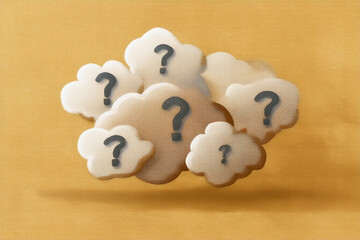 Aufkleber - Beige cloud-like shapes with question marks, on a yellow background, symbolizing uncertainty or the search for answers, suitable for website design or presentations