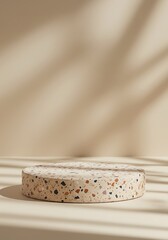 Poster - Circular Display Platform with Beige Terrazzo Pattern and Shadow Overlay