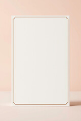 Poster - Blank white card with gold frame stands upright. Simple elegant template for invitation or greeting. Paper with border on pale background. Minimalist design for message.