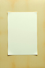 Aufkleber - blank white paper laying on light brown backdrop. empty space for message or art. rectangular paper 