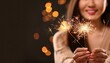 © Innovative - woman holding a sparkler