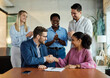 © Lumos sp - young business people meeting office handshake hand shake shaking hands teamwork group contract signing agreement document signature paperwork success corporate senior mature happy smiling