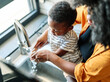 © Lumos sp - child mother hand hygiene family water clean care washing boy son soap woman bathroom together health female little healthy sink home routine morning parent cleaning kid