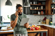 © Lumos sp - kitchen man food communication recipe internet tablet phone call talking mobile mobile phone smartphone telephone guy computer preparing eating home business work office app social media using
