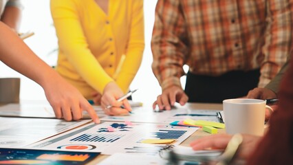 Poster - a diverse team collaborates in a bright office, analyzing data and discussing strategies. colorful s