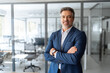 © Stock 4 You - Portrait of indian or latin hispanic mature middle age boss, leader, ceo male businessman in suit in office workplace. Executive confident senior business man specialist looking at camera. Copy space
