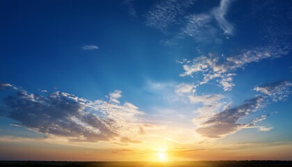 beautiful blue summer sky with bright sun at sunset as a background