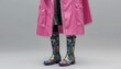 © Napat.T - Colorful Rain Boots Under Pink Waterproof Coat in Fashionable Look for Rainy Days and Style