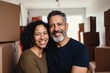 © NikoG - Portrait of a smiling middle age Hispanic couple in empty home after moving in