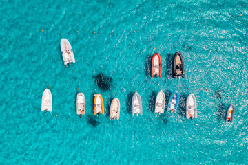 Wall Mural - aerial view of beautiful luxury yacht and boat in blue sea in summer. sardinia, italy. top drone vie