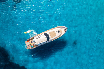 Wall Mural - aerial view of beautiful luxury yacht and boat in blue sea in summer. sardinia, italy. top drone vie
