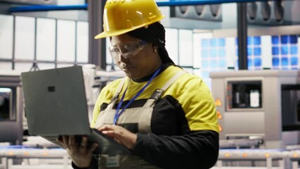 Poster - industrial plant engineer using laptop to implement automated workflows and control systems, compute