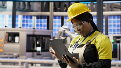 Poster - expert using tablet to conduct routine inspections in industry 4.0 plant producing renewable energy.