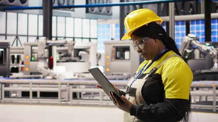 Poster - expert using tablet to conduct routine inspections in industry 4.0 plant producing renewable energy.