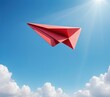 © WutStock02 - A vibrant red paper airplane soars gracefully against a clear blue sky, its crisp edges catching the sunlight as it glides effortlessly through the air.