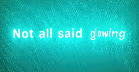 Fototapete - Bright turquoise background displays text. Words Not all said glowing shine, creating visual impact. Simple, modern aesthetic.