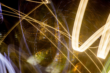 Wall Mural - the image is a blurry, yellowish-orange line that appears to be moving