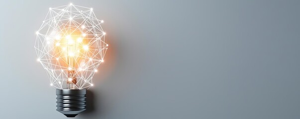 Poster - Polygon lightbulb in business and idea exchange concept. A glowing light bulb design with intricate geometric patterns.