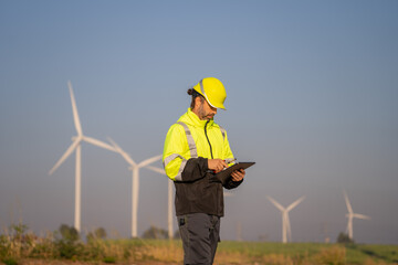 Aufkleber - Engineer man working at windmill farm Generating electricity clean energy. Wind turbine farm generator by alternative green energy.
