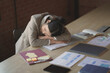 © mojo_cp - Tired asian business woman overworking and Sleep at work