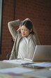 © mojo_cp - Young asian woman stretching relaxation resting office behind her desk working